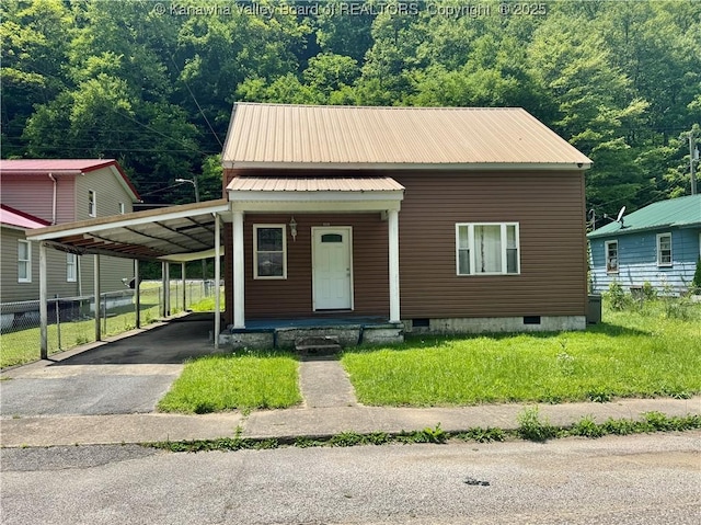 391 Mckinley St, Wharton, WV 25208 - view of front of property with metal roof, a carport, asphalt driveway, covered porch, and crawl space
