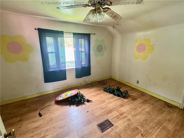 391 Mckinley St, Wharton, WV 25208 - unfurnished room featuring wood finished floors, ceiling fan, and baseboards