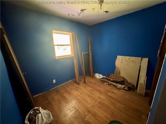 391 Mckinley St, Wharton, WV 25208 - unfurnished bedroom featuring wood finished floors