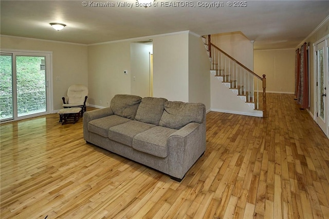106 Coon Hollow Rd, Charleston, WV 25312 - living room with light wood finished floors, ornamental molding, plenty of natural light, stairway, and baseboards