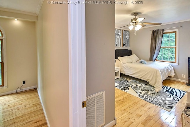 106 Coon Hollow Rd, Charleston, WV 25312 - bedroom featuring ornamental molding, hardwood / wood-style flooring, baseboards, and a ceiling fan