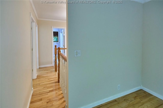 106 Coon Hollow Rd, Charleston, WV 25312 - hall with light wood-style floors, crown molding, baseboards, and an upstairs landing