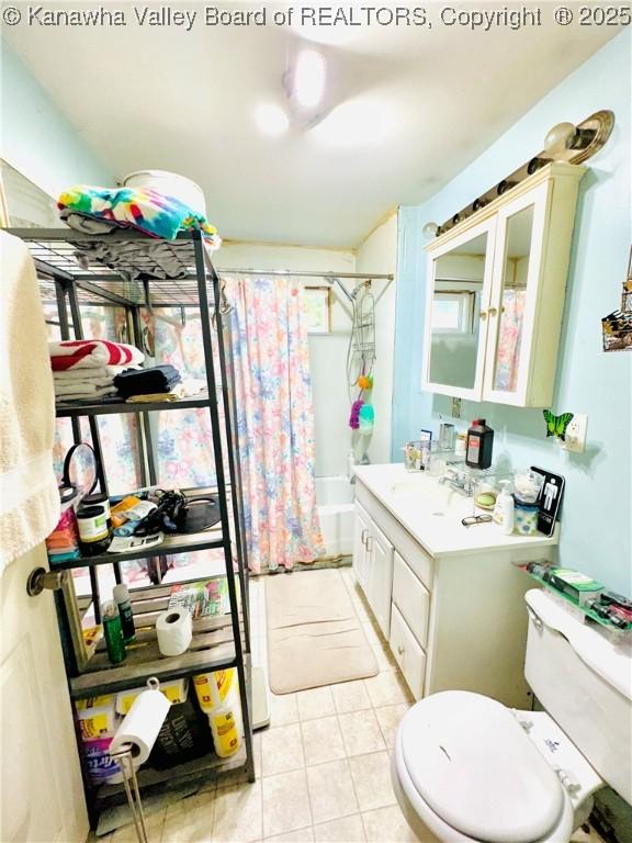 15047 Charleston Rd, Kenna, WV 25248 - bathroom with tile patterned flooring, toilet, vanity, and shower / bathtub combination with curtain