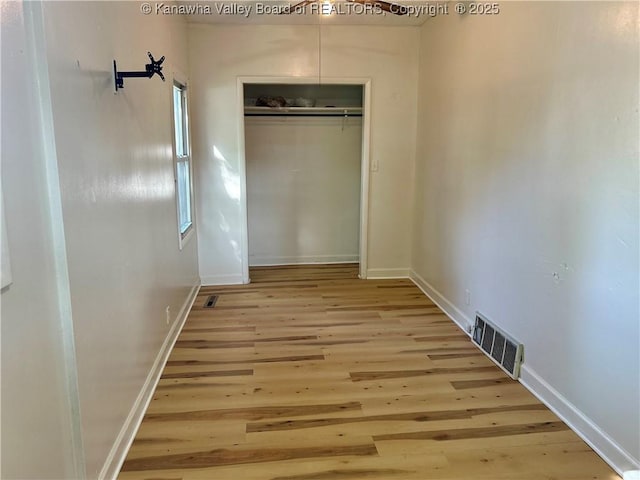 1005 E St, South Charleston, WV 25303 - unfurnished bedroom featuring wood finished floors, a closet, and baseboards