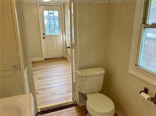 1005 E St, South Charleston, WV 25303 - bathroom featuring wood finished floors, toilet, and baseboards