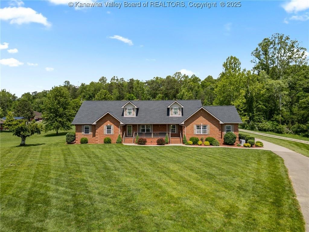 1 Dorothy Ln, Milton, WV 25541 - cape cod house with a porch, a front yard, and brick siding