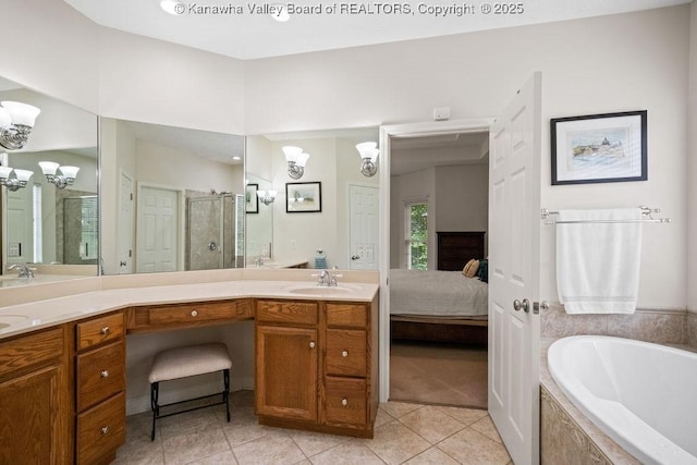 16 Pinnacle Dr, Charleston, WV 25311 - full bathroom featuring a stall shower, a garden tub, tile patterned floors, a chandelier, and double vanity