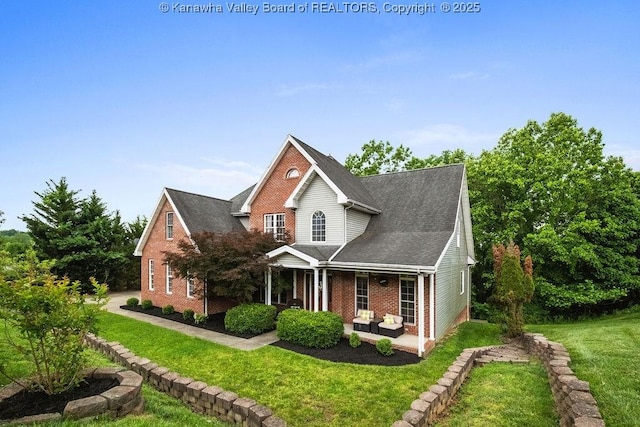 16 Pinnacle Dr, Charleston, WV 25311 - traditional-style house with a front lawn and brick siding