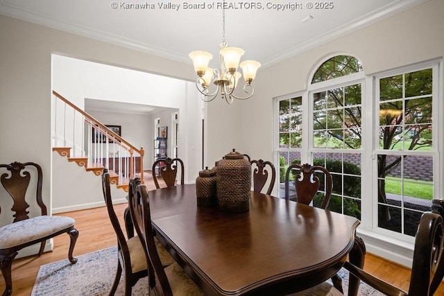 16 Pinnacle Dr, Charleston, WV 25311 - dining room featuring ornamental molding, light wood-style floors, a chandelier, stairs, and baseboards