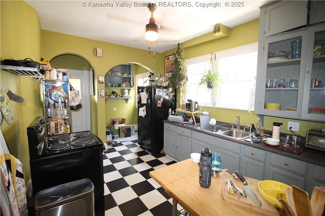 515 Maxwell St, Charleston, WV 25311 - kitchen featuring black appliances, tile patterned floors, a sink, gray cabinetry, and dark countertops