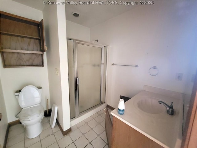 1605 Dunbar Ave, Dunbar, WV 25064 - bathroom featuring a stall shower, toilet, vanity, and baseboards