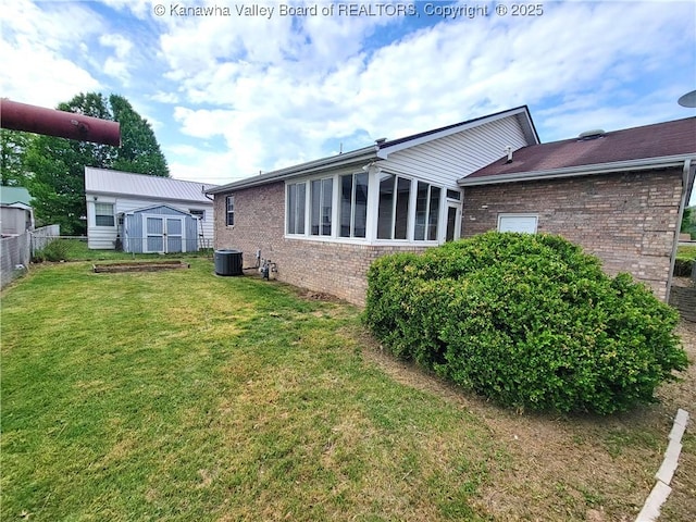 1605 Dunbar Ave, Dunbar, WV 25064 - rear view of property featuring brick siding, cooling unit, and a sunroom