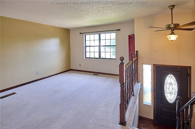 100 Timberlake Cir, Scott Depot, WV 25560 - carpeted entryway featuring a textured ceiling, ceiling fan, and baseboards