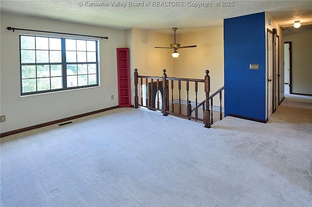 100 Timberlake Cir, Scott Depot, WV 25560 - spare room with carpet flooring, baseboards, a textured ceiling, and a ceiling fan