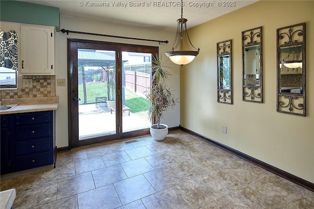 100 Timberlake Cir, Scott Depot, WV 25560 - unfurnished dining area featuring baseboards and a sink