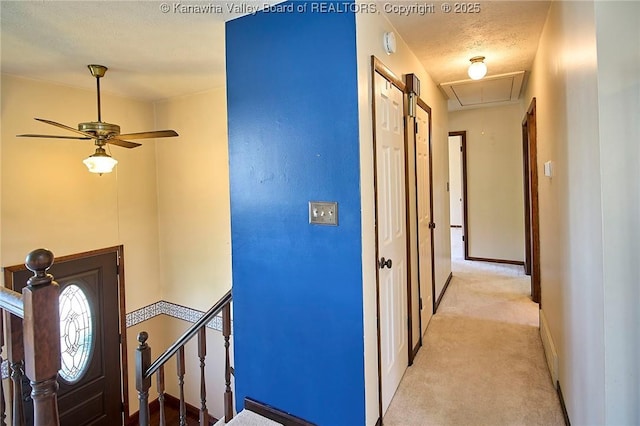 100 Timberlake Cir, Scott Depot, WV 25560 - corridor with an upstairs landing, light colored carpet, attic access, and a textured ceiling