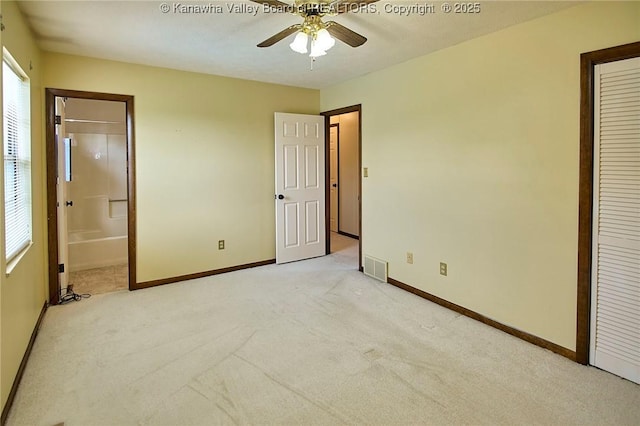 100 Timberlake Cir, Scott Depot, WV 25560 - unfurnished bedroom with light colored carpet, baseboards, connected bathroom, and a closet