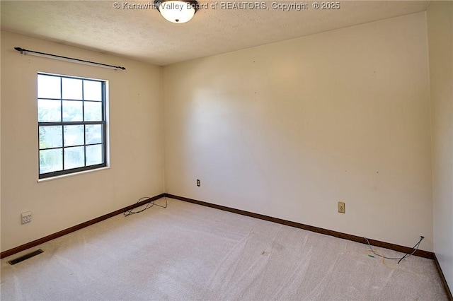 100 Timberlake Cir, Scott Depot, WV 25560 - empty room featuring light carpet, baseboards, and a textured ceiling