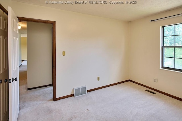 100 Timberlake Cir, Scott Depot, WV 25560 - empty room featuring light carpet, baseboards, and a textured ceiling