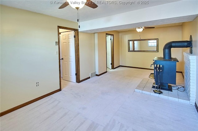 100 Timberlake Cir, Scott Depot, WV 25560 - exercise room with a wood stove, ceiling fan, baseboards, and carpet