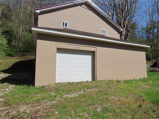 3321 Heizer Creek Rd, Poca, WV 25159 - view of home's exterior with stucco siding and a garage
