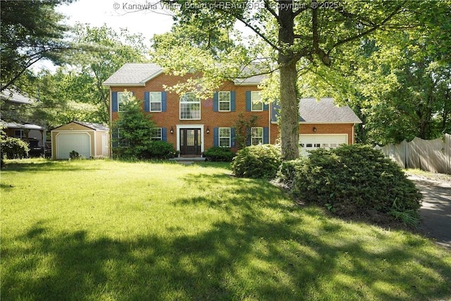 9 Shamblin Pl, Charleston, WV 25314 - colonial-style house with brick siding, a garage, and an outbuilding