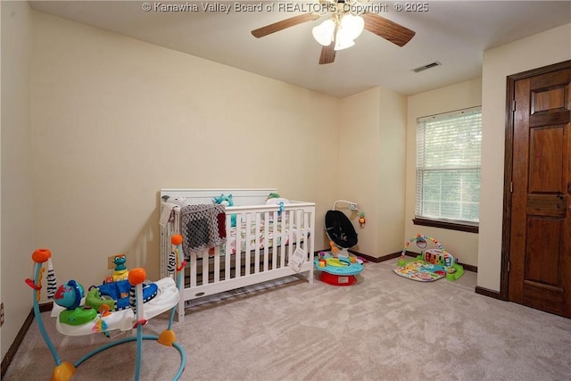 9 Shamblin Pl, Charleston, WV 25314 - carpeted bedroom featuring baseboards, a ceiling fan, and a crib