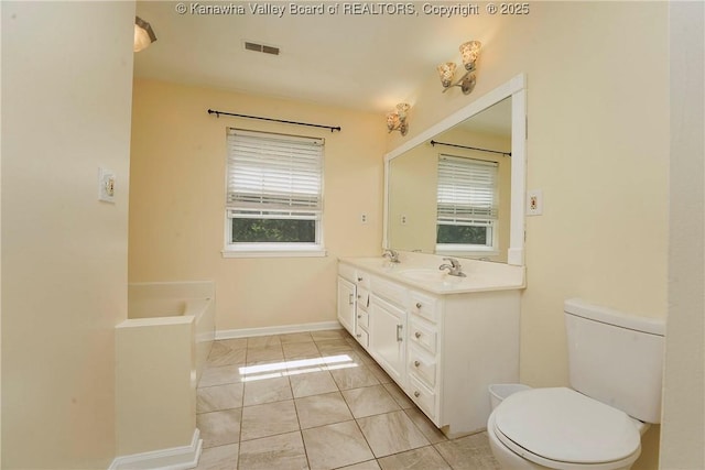 9 Shamblin Pl, Charleston, WV 25314 - full bathroom with plenty of natural light, toilet, double vanity, and a bath