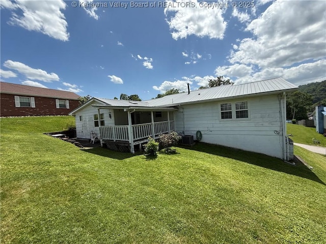 40 Hickory Ln, Madison, WV 25130 - rear view of house with a yard, a porch, central AC unit, and metal roof