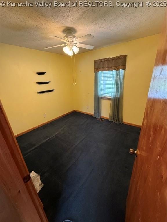 40 Hickory Ln, Madison, WV 25130 - empty room featuring a textured ceiling, ceiling fan, and baseboards