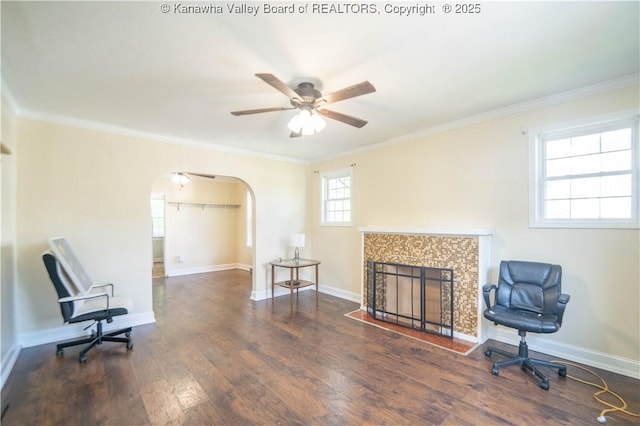 300 Forest Cir S, Charleston, WV 25303 - living area with a tile fireplace, a ceiling fan, arched walkways, crown molding, and wood finished floors