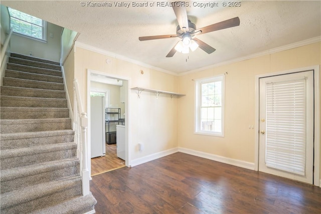 300 Forest Cir S, Charleston, WV 25303 - unfurnished living room featuring a textured ceiling, stairs, wood finished floors, ceiling fan, and crown molding