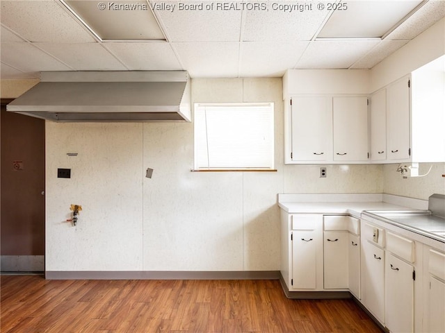 463 Gap View Dr, Charleston, WV 25326 - kitchen featuring a paneled ceiling, baseboards, light wood-style flooring, light countertops, and white cabinetry