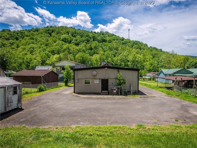 463 Gap View Dr, Charleston, WV 25326 - view of outdoor structure featuring a wooded view