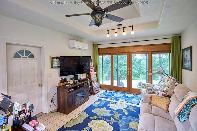 920 Gordon Dr Unit A, Charleston, WV 25303 - living area featuring a wall unit AC, healthy amount of natural light, a raised ceiling, and light tile patterned floors