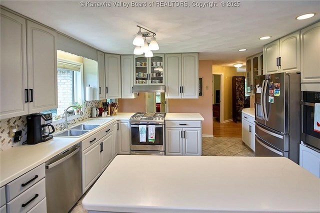 920 Gordon Dr Unit A, Charleston, WV 25303 - kitchen with appliances with stainless steel finishes, glass insert cabinets, tasteful backsplash, light tile patterned floors, and recessed lighting