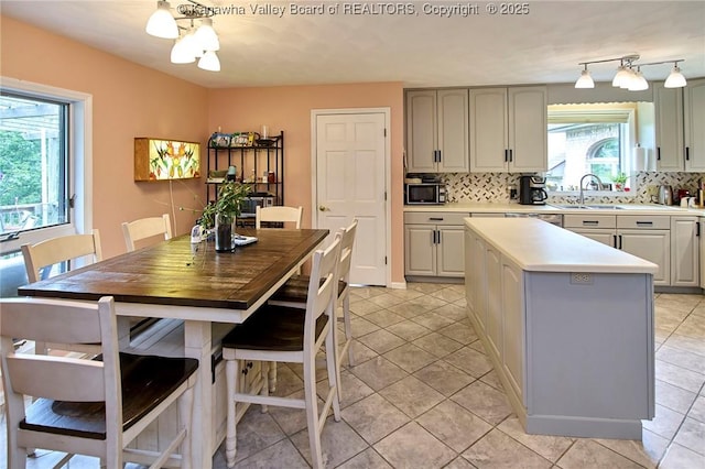 920 Gordon Dr Unit A, Charleston, WV 25303 - kitchen with tasteful backsplash, stainless steel microwave, and light countertops