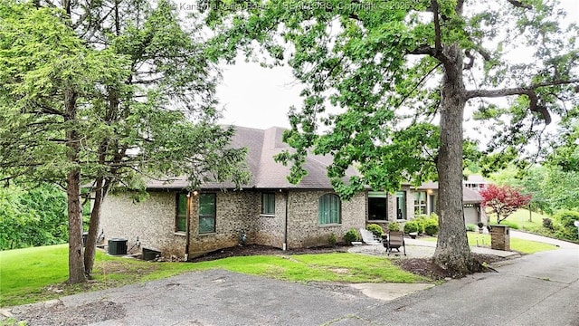 920 Gordon Dr Unit A, Charleston, WV 25303 - view of front of house featuring brick siding, a front yard, and a shingled roof