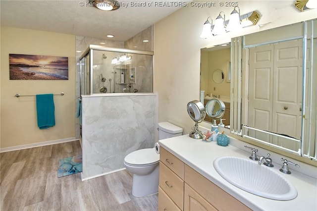 920 Gordon Dr Unit A, Charleston, WV 25303 - bathroom with a shower stall, wood finished floors, vanity, a closet, and a textured ceiling