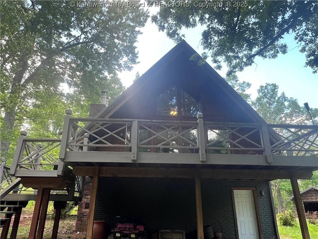 849 Random Rd, Ripley, WV 25271 - back of house featuring a wooden deck, brick siding, stairs, and a carport