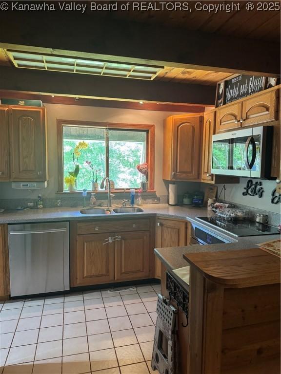 849 Random Rd, Ripley, WV 25271 - kitchen featuring appliances with stainless steel finishes, a sink, and light tile patterned floors