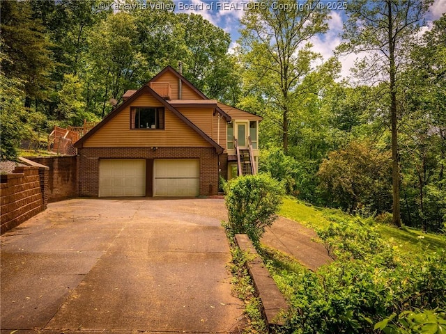1799 Fishers Branch Rd, Charleston, WV 25312 - traditional-style house featuring brick siding, driveway, and a garage