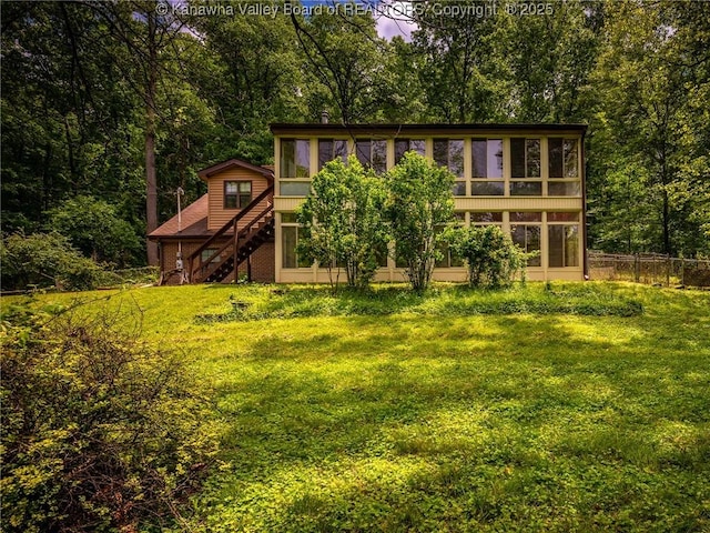 1799 Fishers Branch Rd, Charleston, WV 25312 - rear view of house with a sunroom, stairway, and a forest view