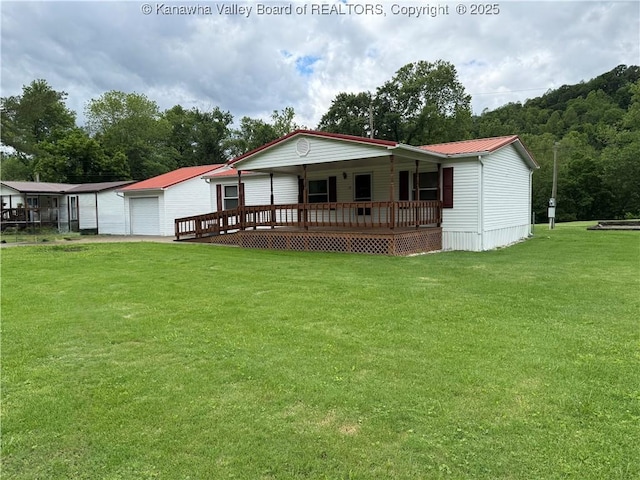12 Brewster Dr, Chapmanville, WV 25508 - rear view of property with a porch, a lawn, and metal roof