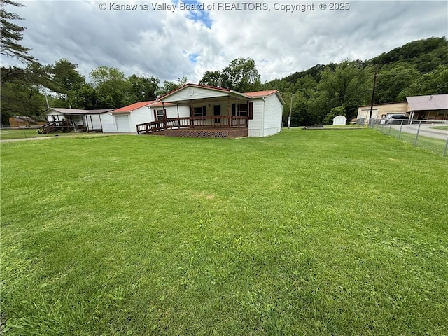 12 Brewster Dr, Chapmanville, WV 25508 - view of yard with a garage and a wooden deck