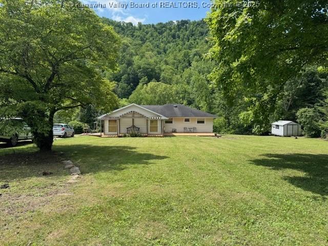 80 Flint Ln, Racine, WV 25165 - view of grassy yard featuring a wooded view