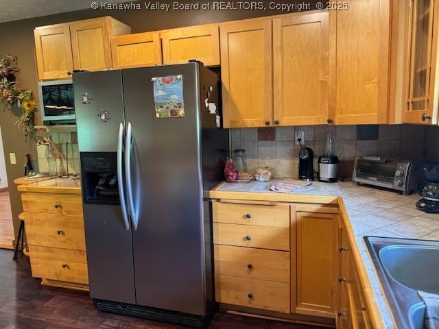 80 Flint Ln, Racine, WV 25165 - kitchen featuring stainless steel fridge with ice dispenser, tile countertops, tasteful backsplash, dark wood-style floors, and a sink