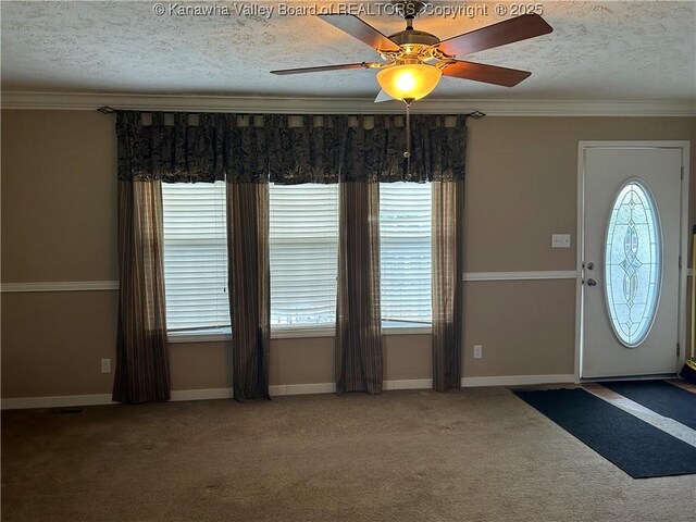 30 Beech Ln, Madison, WV 25130 - carpeted foyer featuring a textured ceiling, ornamental molding, ceiling fan, and baseboards