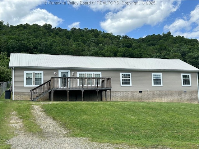 30 Beech Ln, Madison, WV 25130 - back of property featuring a lawn, a deck, crawl space, and a forest view