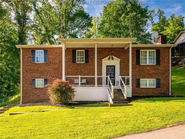 1019 Lynn Oak Dr, Cross Lanes, WV 25313 - split foyer home with a front lawn, brick siding, and a chimney